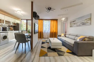 a living room with a couch and a table at Sweet Home 2 in Sandanski