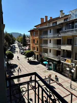 a view of a street in a city with buildings at Бутиков Семеен Хотел БРИО in Velingrad