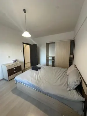 a bedroom with a large bed and a desk at Lions Bridge C-E-N-T-R-A-L in Sofia
