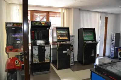 a group of video game machines in a room at Belvedere 1Bedroom Apartment with Kitchen in Bansko