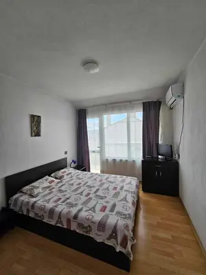 a bedroom with a bed and a window at Apartment Friends in Sandanski
