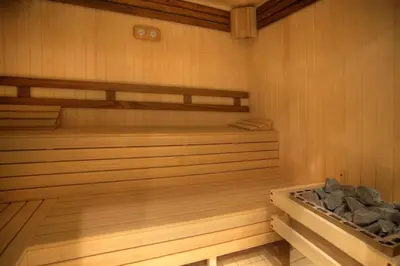a sauna with wooden walls and wooden floors and a wooden at Exquisite Euphoria apartment for 4 Guests in Borovets Ski Resort in Borovets