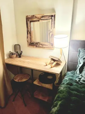 a bedroom with a desk with a mirror and a bed at Exquisite Euphoria apartment for 4 Guests in Borovets Ski Resort in Borovets