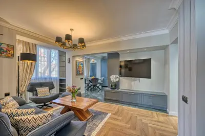 a living room with a couch and a tv at A new sense of home in Sofia