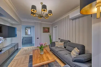 a living room with a couch and a table at A new sense of home in Sofia