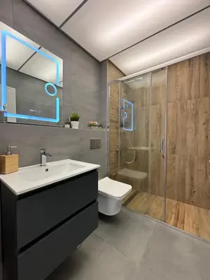 a bathroom with a toilet and a sink and a shower at Apartamento Violette OLD Town Plovdiv in Plovdiv