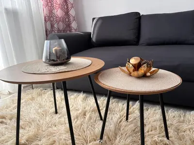 two tables in a living room with a couch at Apartamento Violette OLD Town Plovdiv in Plovdiv