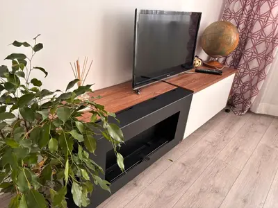 a flat screen tv sitting on top of a fireplace at Apartamento Violette OLD Town Plovdiv in Plovdiv