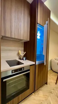 a kitchen with a stove and a refrigerator at High End Elegant Living & Free Parking in Sofia