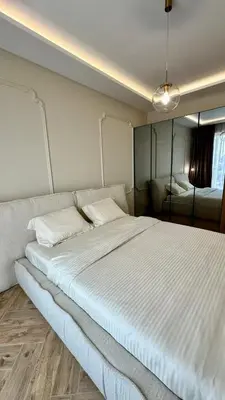 a bedroom with a large bed with white sheets at High End Elegant Living & Free Parking in Sofia