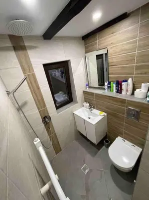 a bathroom with a toilet and a sink at Forest Hill in Troyan