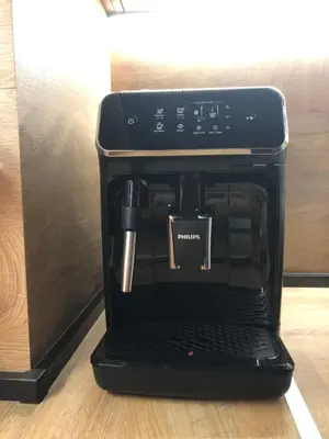a black coffee maker is sitting on a table at Stylish 2BDR apartment Gramada, free parking in Sofia