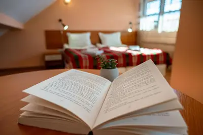 an open book sitting on a table with a room at Chalet Bizet cosy home in BANSKO in Bansko