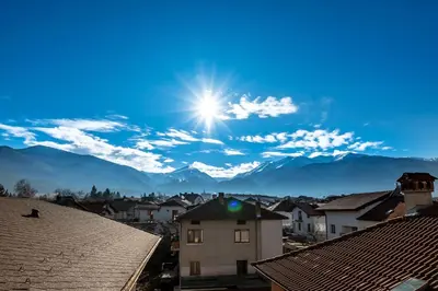 a view of a city with mountains in the background at Chalet Bizet cosy home in BANSKO in Bansko