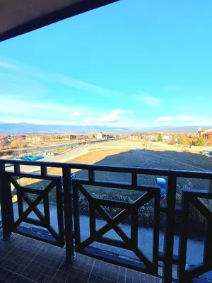 a view of a beach from a balcony at Vihren Palace Residence, close to Gondola lift,211 in Bansko