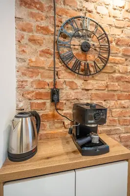 a kitchen counter with a coffee maker and a mixer at Nova Nook in Sofia