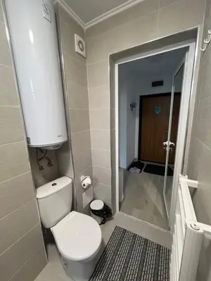 a bathroom with a toilet and a walk in shower at PARK ESCAPE Holiday Home 24h check in in Sandanski