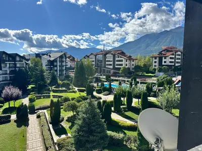 a view of a park with houses and trees at Aspen Golf Apartment with Stunning Mountain View in Bansko