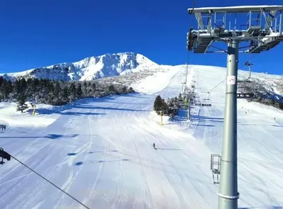 a ski lift on a snow covered mountain at Dream apart-hotel, duplex apartment in Bansko