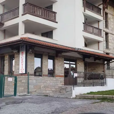 an external view of a building with a balcony at Apartment Melania in Complex Royal Towers in Bansko
