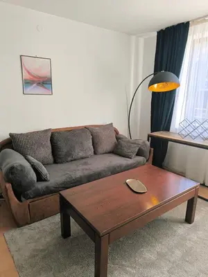 a living room with a couch and a coffee table at Botanique - Cozy stay with free Bottle of Wine in Bansko