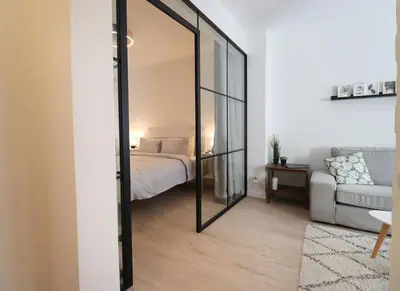 a bedroom with a bed and a large mirror at Urban Chic Sofia Top Central Location in Sofia