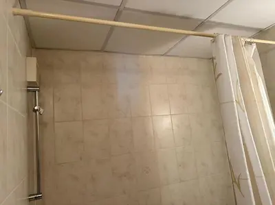 a shower in a bathroom with a shower curtain at Cozy apartmen with Mountain view in Bansko