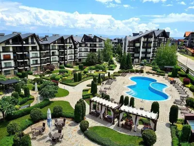 an aerial view of an apartment complex with a swimming pool at Cozy apartmen with Mountain view in Bansko