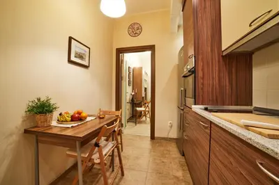 a kitchen with a table with fruit on it at Central Luxury Cozy Modern Apartment in Sofia