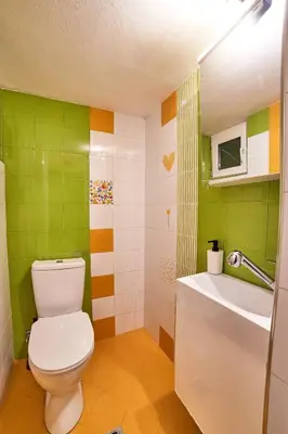 a bathroom with a toilet and a sink at Central Luxury Cozy Modern Apartment in Sofia
