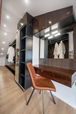 a dressing room with a bench and a mirror at Host2U Penthouse Sauna, Jacuzzi, Fireplace in Bansko