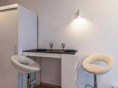 a table with two chairs and two glasses on it at Stay Inspired - Sofia Retreat in Sofia