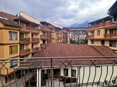 a view of a group of buildings with a roof at Mountain View Home Maggie in Bansko