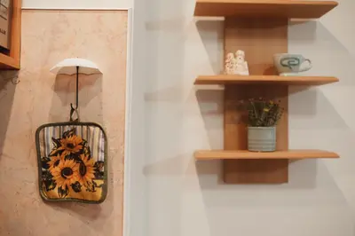 a shelf with a basket on a wall with a plant at Apartment Rhea with Terrace & Parking in Plovdiv