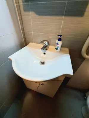 a bathroom sink with a bottle of soap on it at BELVEDERE Holiday Club VIP 59 in Bansko
