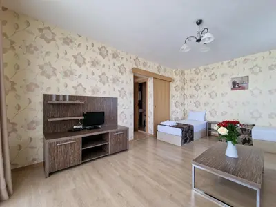 a living room with a couch and a bed in a room at Айляк Клуб Хисаря - Бутиков Хотел&СПА с Elegant Ultra All Inclusive in Hisarya