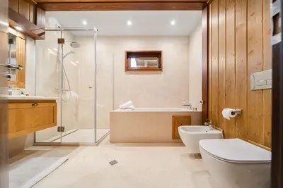 a bathroom with a shower and a toilet and a sink at Bansko Lux Villas for Ski & Chill in Razlog
