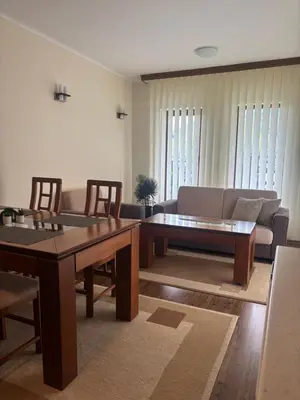 a living room with a couch and a table at Bella Si Relax in Bansko