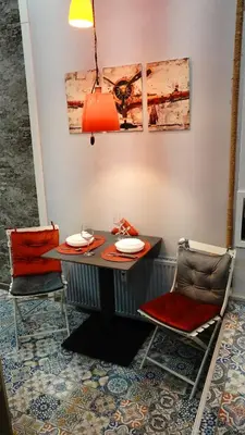 a dining room with a table and two chairs at Apartment Hangar 94 - Top Center - plus Free Vouchers in Sofia