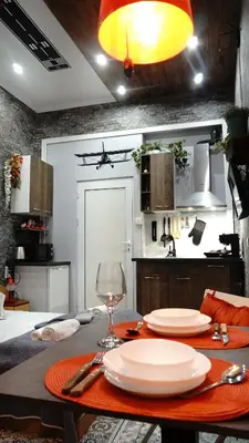 a kitchen with a table with plates and a wine glass at Apartment Hangar 94 - Top Center - plus Free Vouchers in Sofia