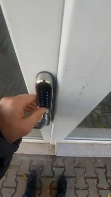 a person holding a cell phone in front of a door at Apartment Hangar 94 - Top Center - plus Free Vouchers in Sofia