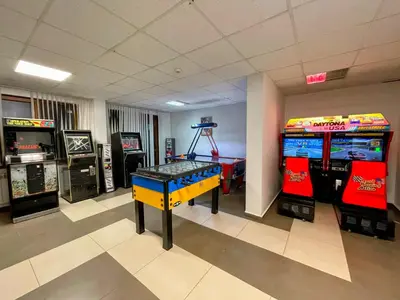 a room with two arcade games and two video games at One-bedroom Apartment at Belvedere Holiday Club Complex in Bansko