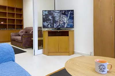 a living room with a tv and a coffee table at Sofia Office Loft in Sofia