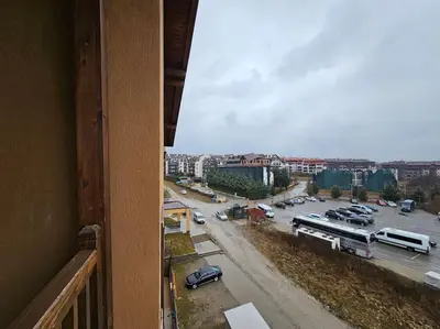 a view of a parking lot from a balcony at CROWN Apartment Bansko in Bansko