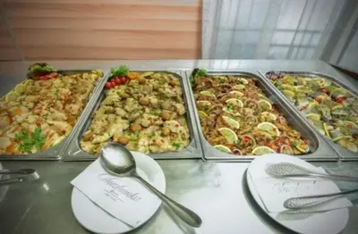 a table with three trays of different types of food at Pamporovo hotel Snezhanka A640 in Pamporovo