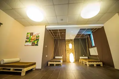 a waiting room with two beds and a mirror at Pamporovo hotel Snezhanka A640 in Pamporovo