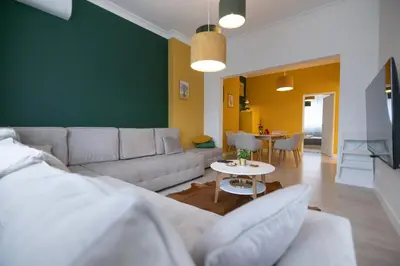 a living room with a couch and a table at Contemporary Vintage, 3BDR Grace Suite in Sofia