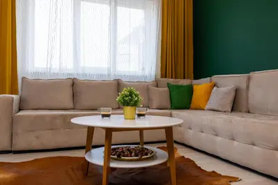 a living room with a couch and a table at Contemporary Vintage, 3BDR Grace Suite in Sofia