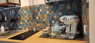 a kitchen counter with a mixer on a counter top at Leaf apartment in Blagoevgrad
