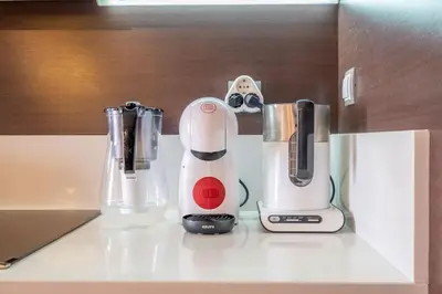 a blender and other appliances sitting on a counter at iLonka's Home 1 BDR with Workspace and Terrace in Sofia